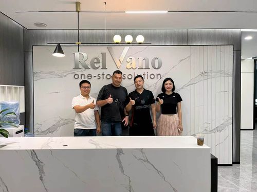 Relvano sales team with client reviewing whole-house custom cabinetry